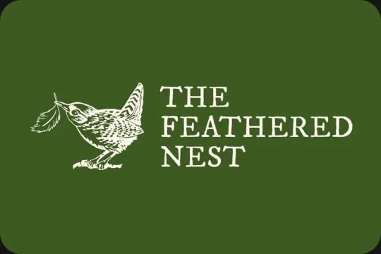 The Feathered Nest logo, a small bird beside the name, in white on green
