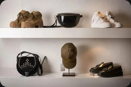 Shoes, a hat and bags displayed on shelves in the Morgan Clare boutique