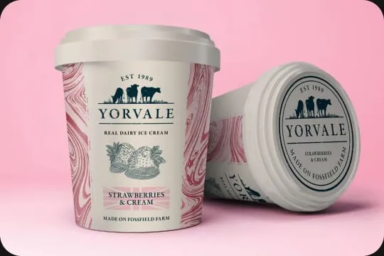Two tubs of Yorvale ice cream on a pink background