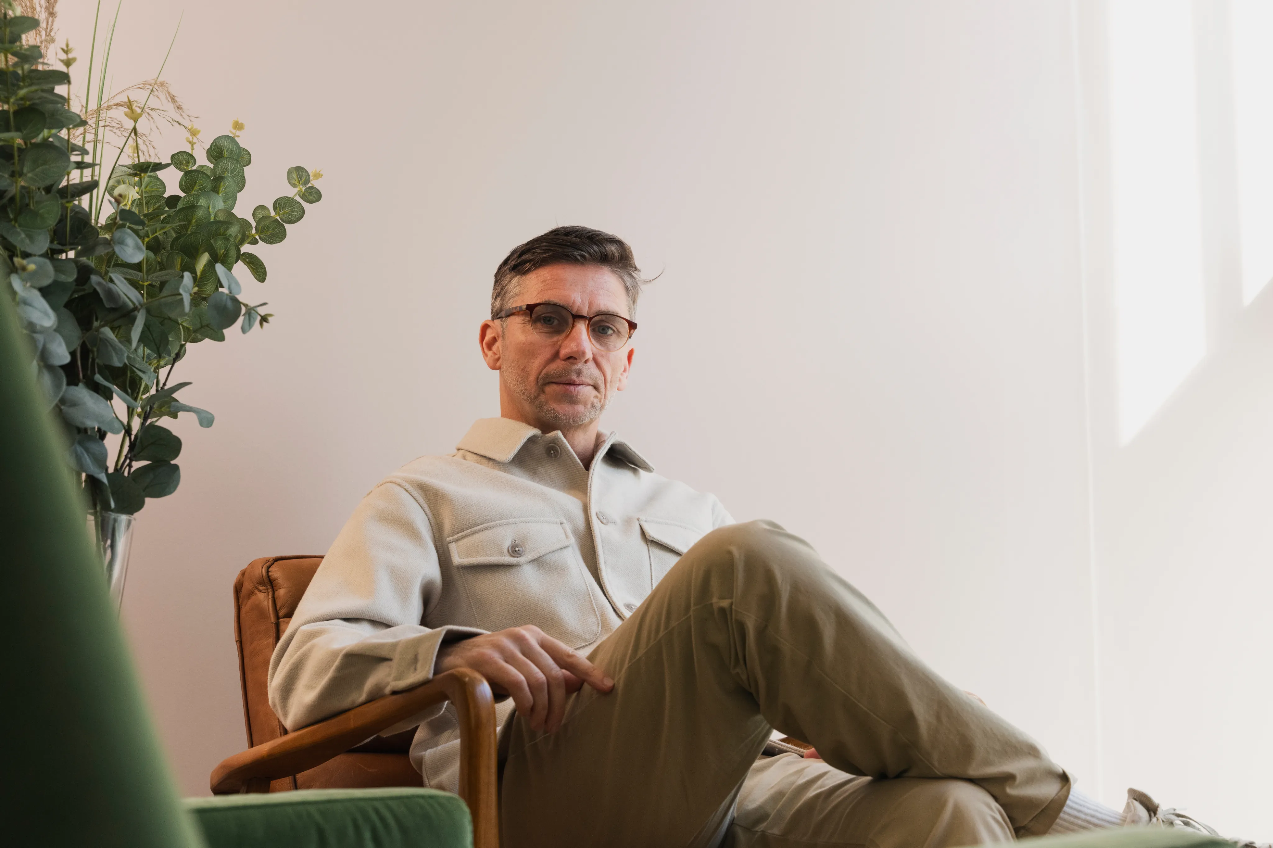 One of the team relaxing in an armchair