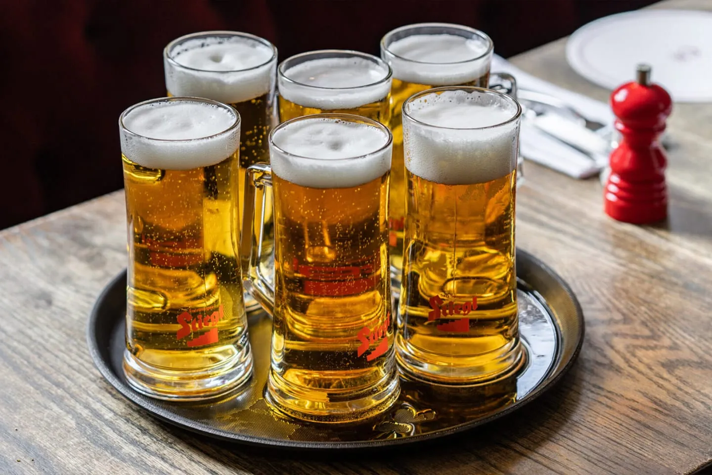 Glasses of beer on a tray at a Cubitt House pub