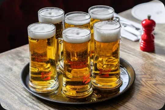 Glasses of beer on a tray at a Cubitt House pub
