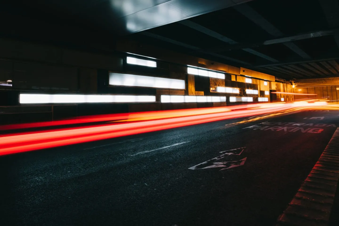 Streaks of car light on a road at night