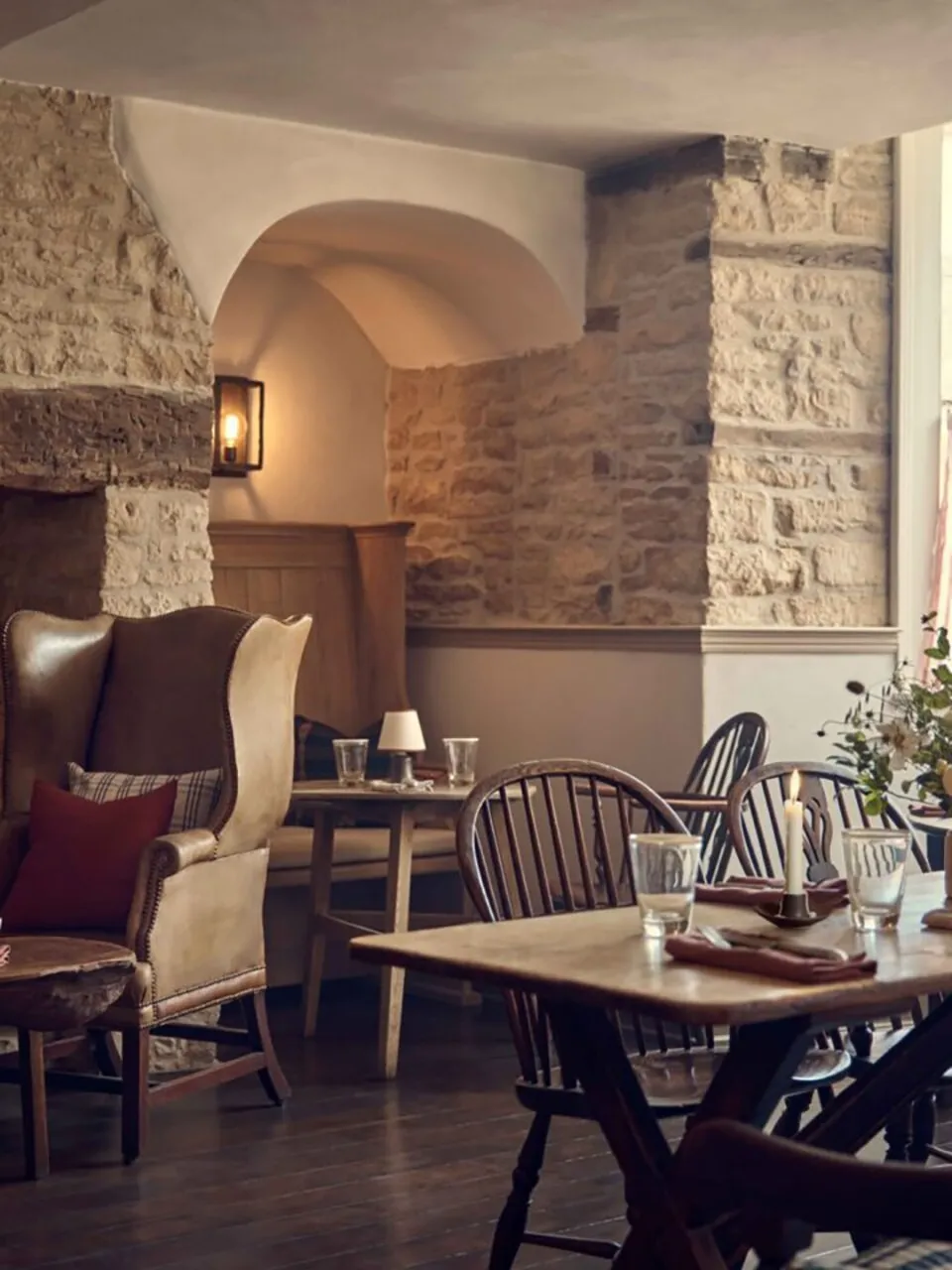 A Daylesford pub dining room with stone walls and wooden tables