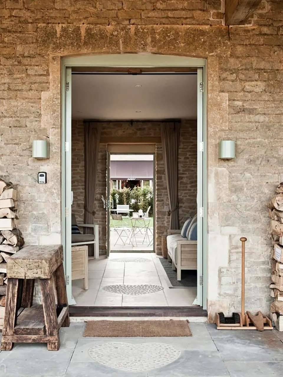 A stone doorway opening onto a garden path