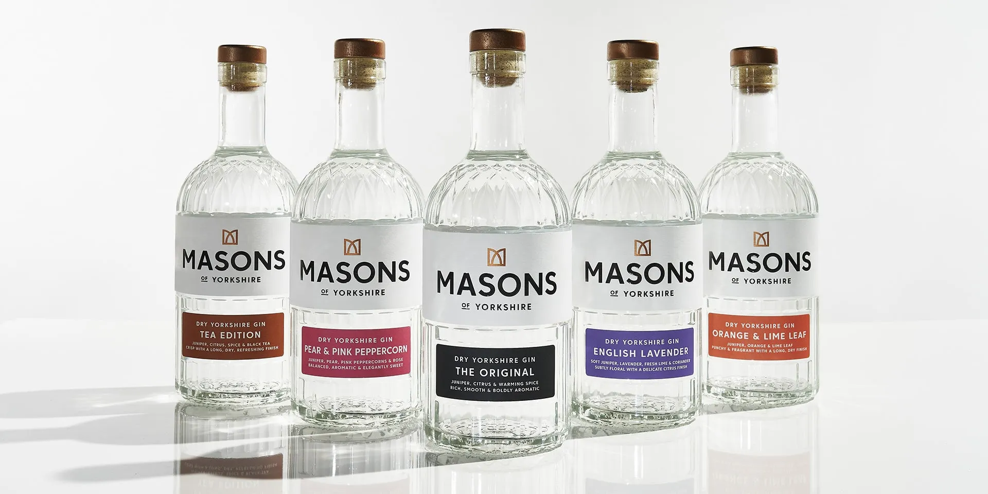 Five bottles of Masons of Yorkshire gin in a row