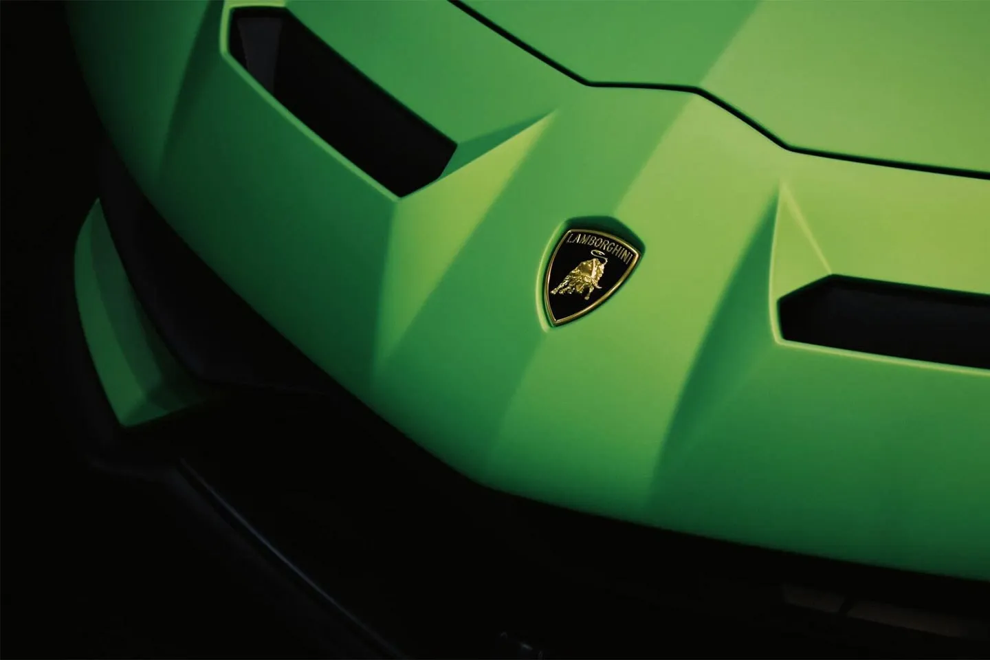 The bonnet of a green Lamborghini, close up