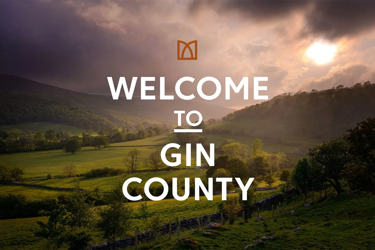 “Welcome to Gin County” over a Yorkshire valley at sunset