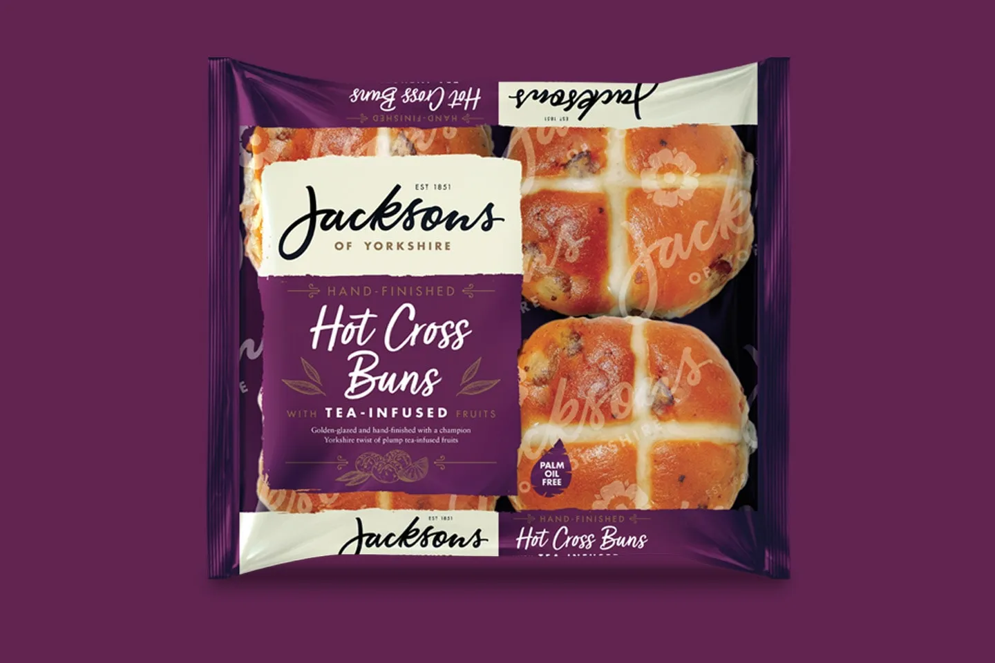 A pack of Jacksons hot cross buns on a purple background