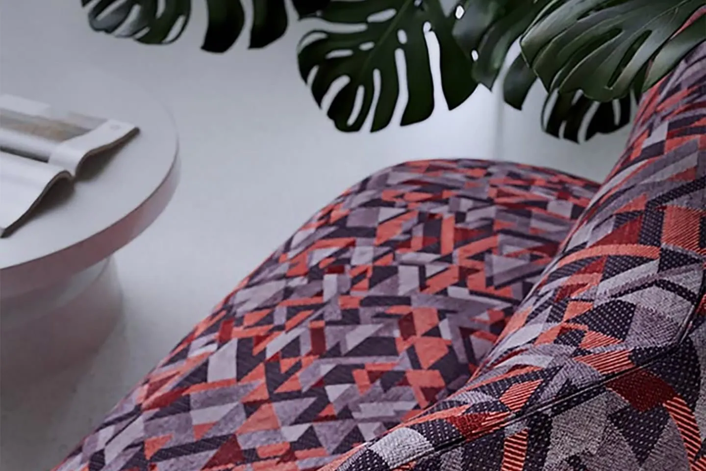 A sofa upholstered in a bold patterned TextileMania fabric