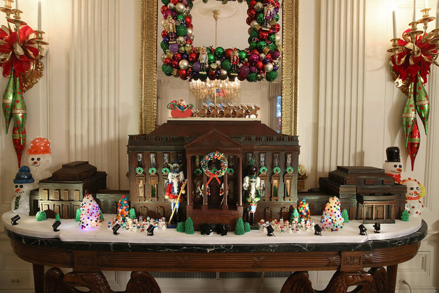 WASHINGTON, DC - DECEMBER 02: A chocolate gingerbread house is on display in the State Dining Room during first lady Michelle Obama's preview of the 2015 holiday decor at the White House December 2, 2015 in Washington, DC. As part of the Joining Forces initiative, the first lady welcomed military families to the White House for the first viewing of the 2015 holiday decorations. (Photo by Mark Wilson/Getty Images)